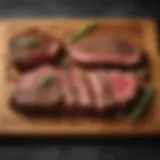A variety of steak cuts displayed on a wooden board