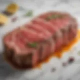 A beautifully marbled steak displayed with herbs and spices