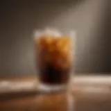 Freshly brewed iced coffee in a glass with ice cubes
