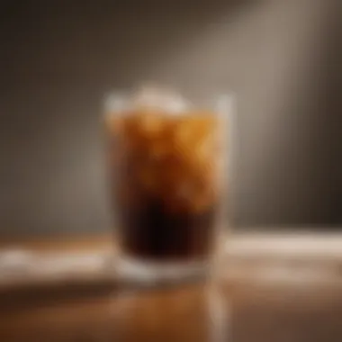 Freshly brewed iced coffee in a glass with ice cubes