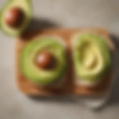 Spoonful of avocado spread on a slice of bread