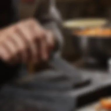 A skilled chef honing a high carbon knife on a sharpening stone