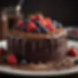A rich vegan chocolate cake topped with fresh berries and cocoa dust.