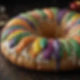 A vibrant king cake adorned with colorful icing and sprinkles