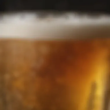 A close-up of a chilled glass of non-alcoholic beer with a frothy head.