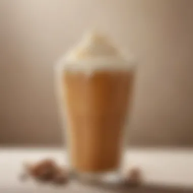 A close-up of a beautifully crafted milk tea topped with frothy cream.