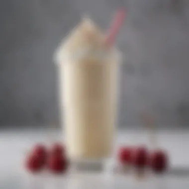 Classic Vanilla Milkshake A close-up of creamy vanilla milkshake topped with whipped cream and a cherry