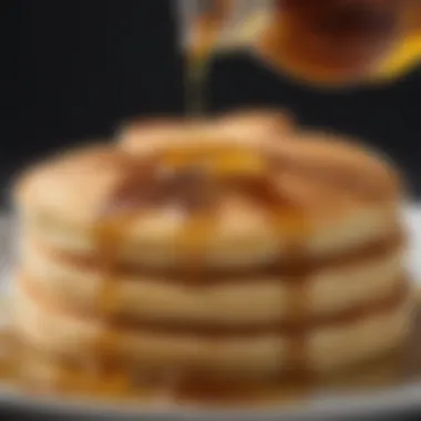 A close-up of a low-calorie syrup being drizzled on pancakes