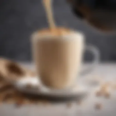 Close-up of oat milk being poured into a coffee cup