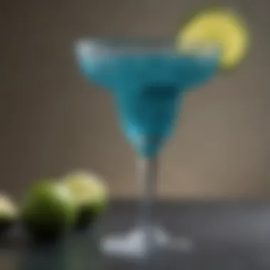 Close-up of teal margarita glass showcasing intricate design