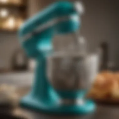 Close-up view of the teal stand mixer showcasing its intricate design