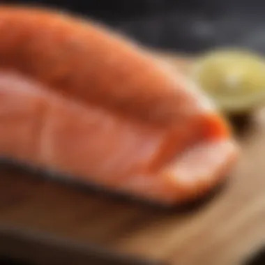 Vibrant Atlantic salmon fillet on a wooden cutting board